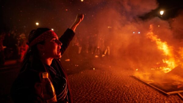 France pension protests: Crowd clashes with police over government reform by decree